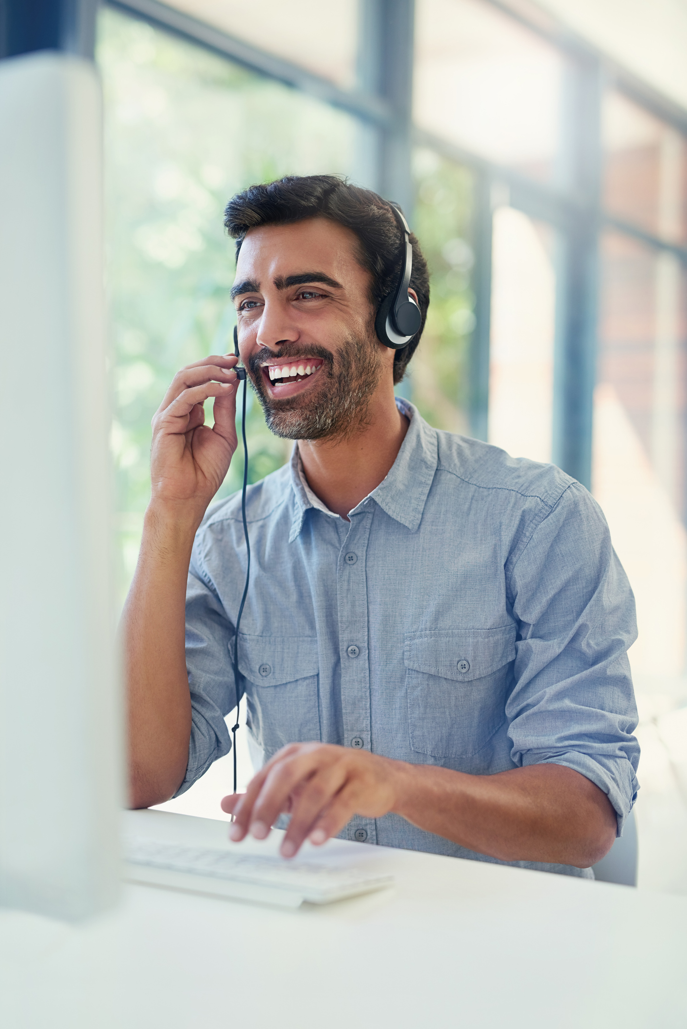 Cropped shot of a call centre agent working in an office